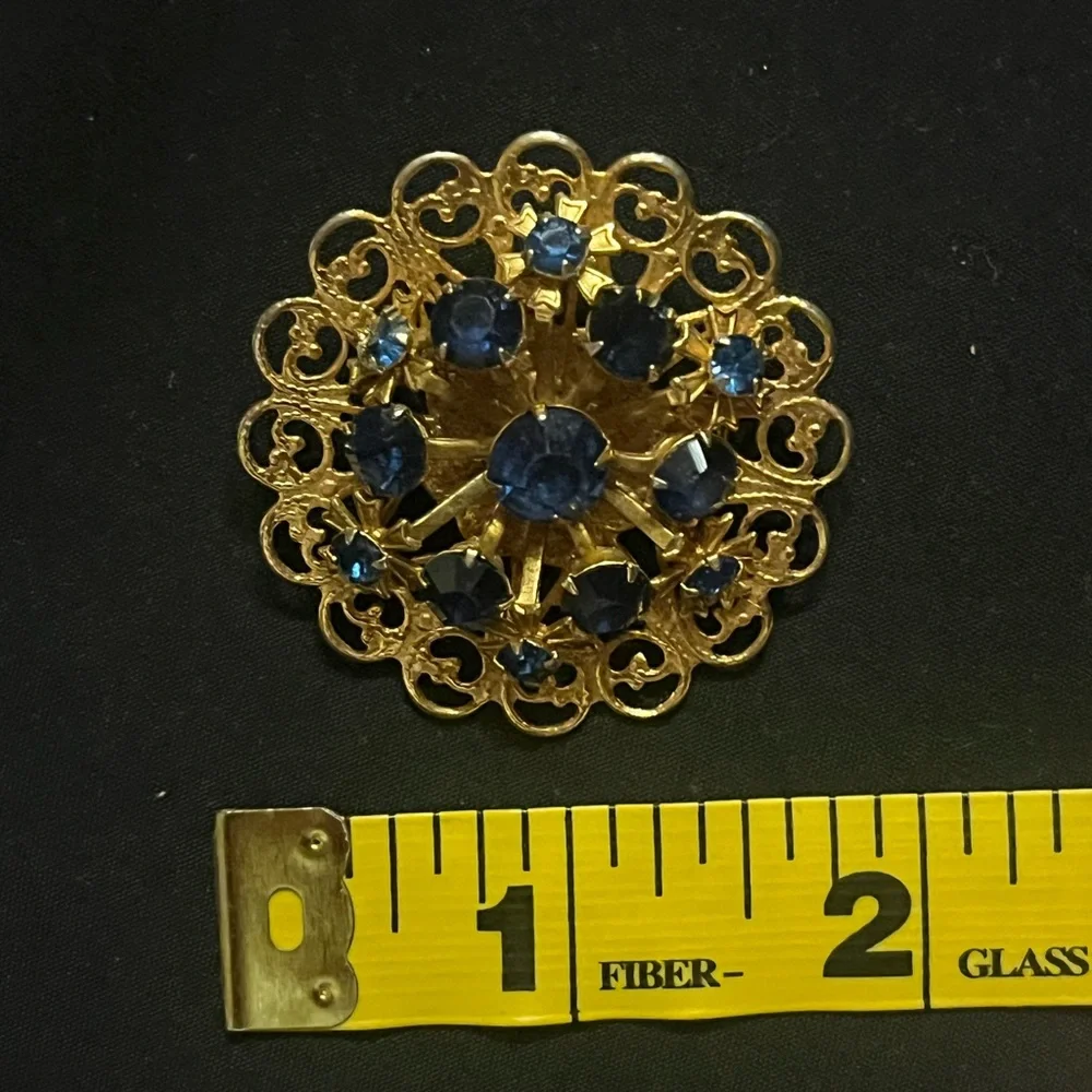 Vintage Gold Tone Circle Brooch with Deep Blue Rhinestones